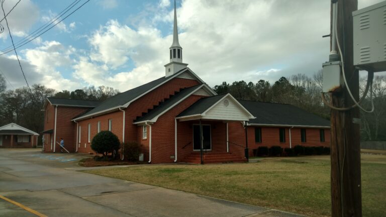 Wide angle view of Asphalt Shingles roof of a church installed by Thaxton Roofing
