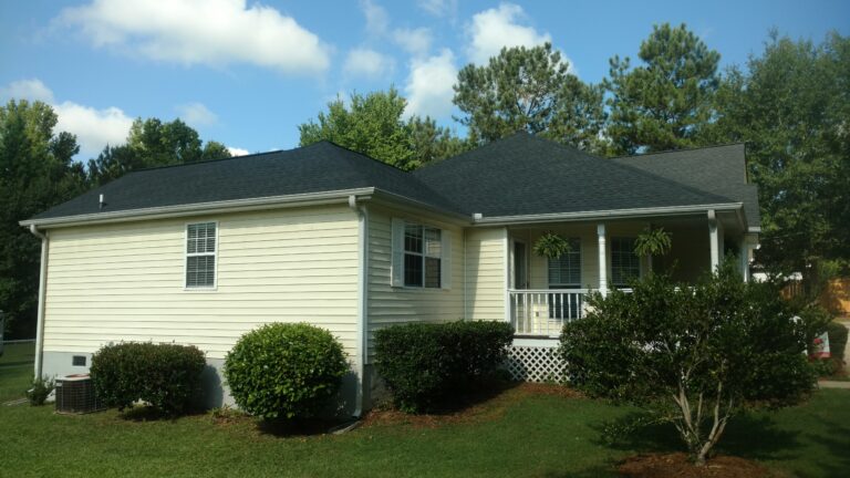 A house with newly installed matt black roof installed by Thaxton Roofing