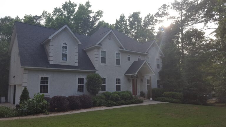 A double story house with curb roof repaired by Thaxton Roofing