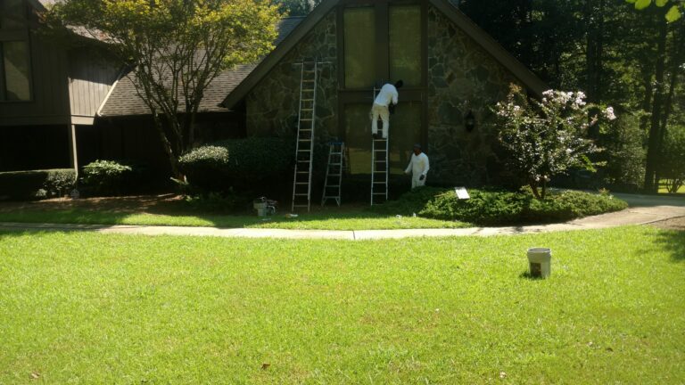 Worker doing roof repairing on a House in Georgia