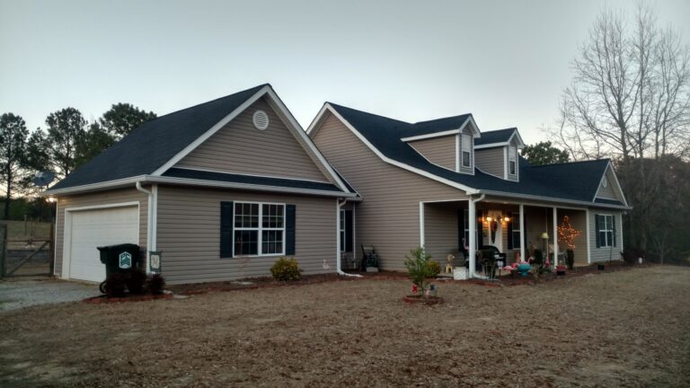 side view of a Country side house with a newly installed roof by Thaxton Roofing in Georgia