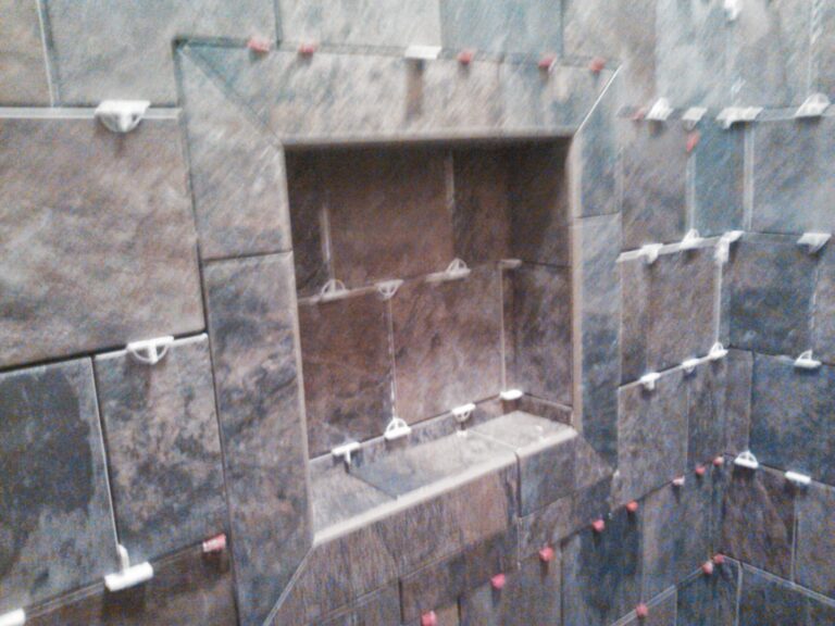 bathroom remodeled with brown tiles