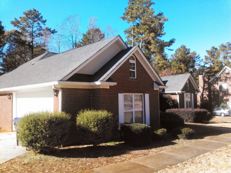 Residential roofing in Georgia on a brick townhouse