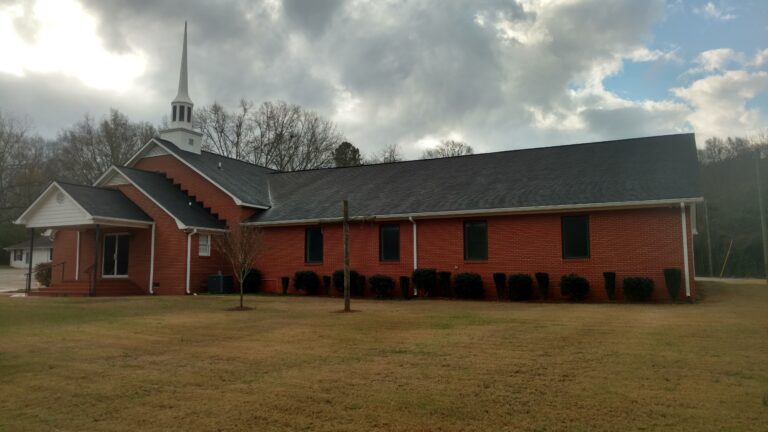 wide angle image of a church with a newly repaired roof by Thaxton Roofing