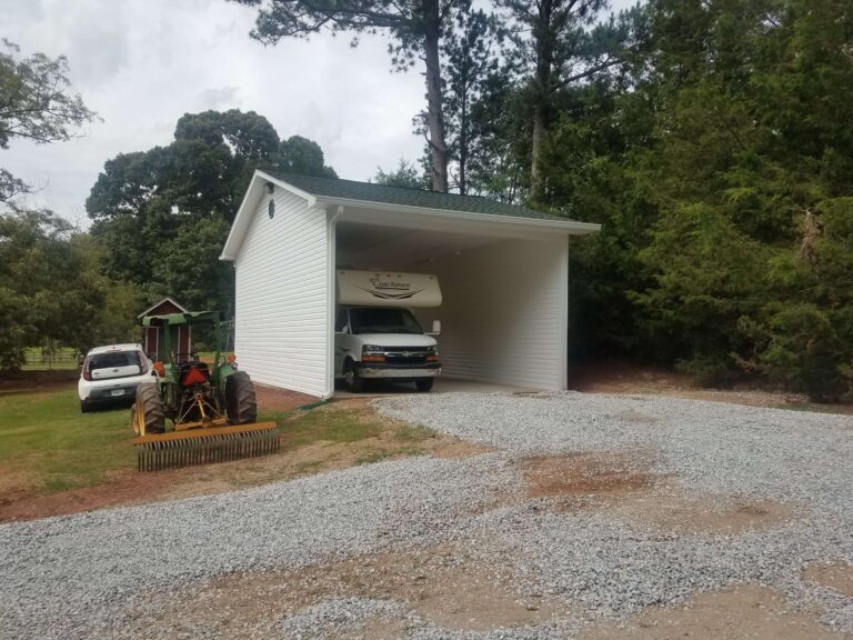White carpark with a newly repaired roof covering an RV